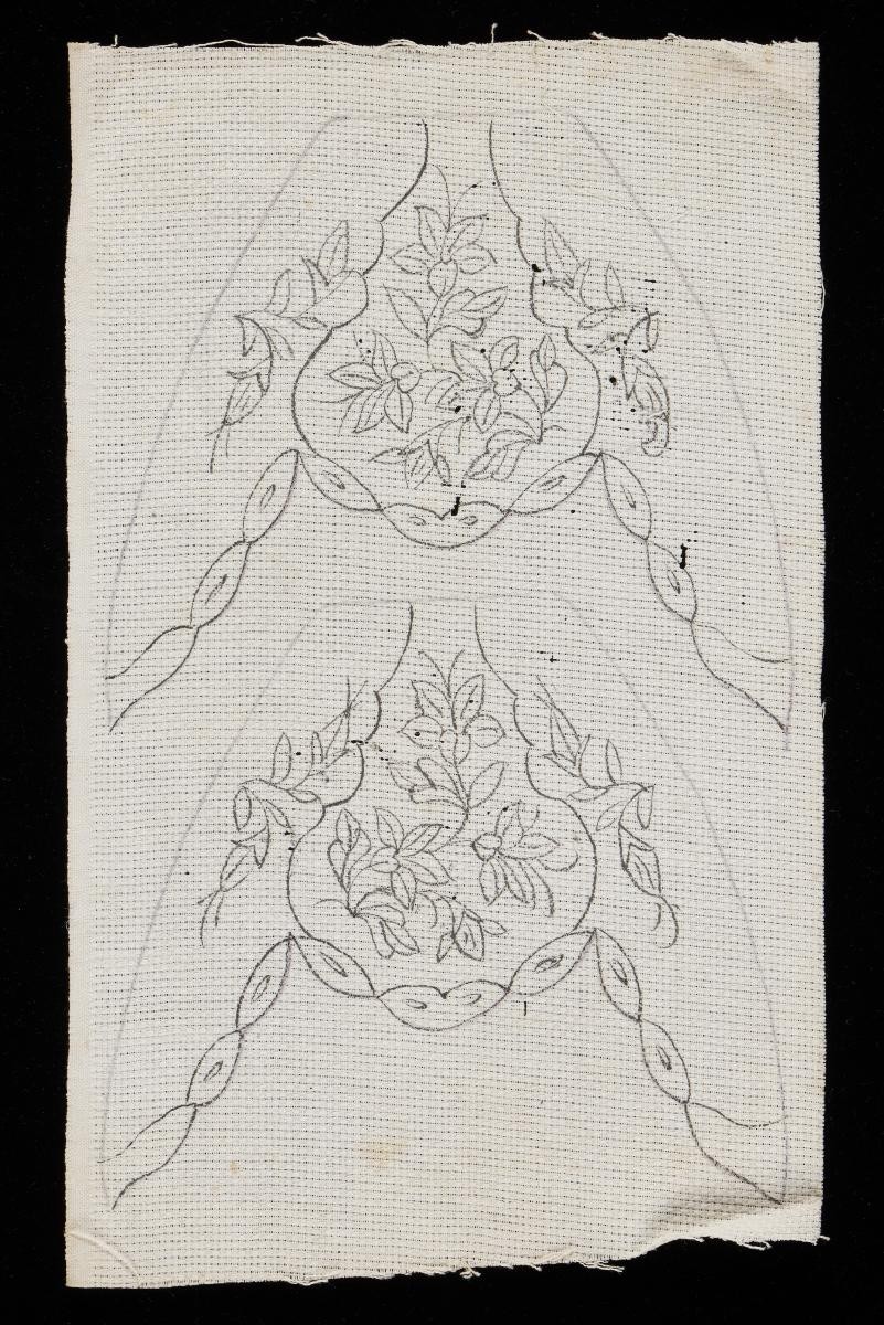 1 drawn design of slipper face on canvas