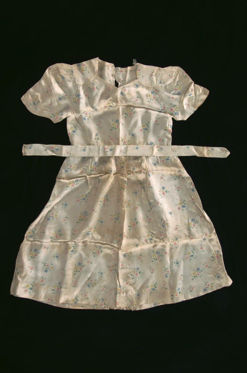 Western-style dress and sash outfit worn during a Chinese wedding tea ceremony