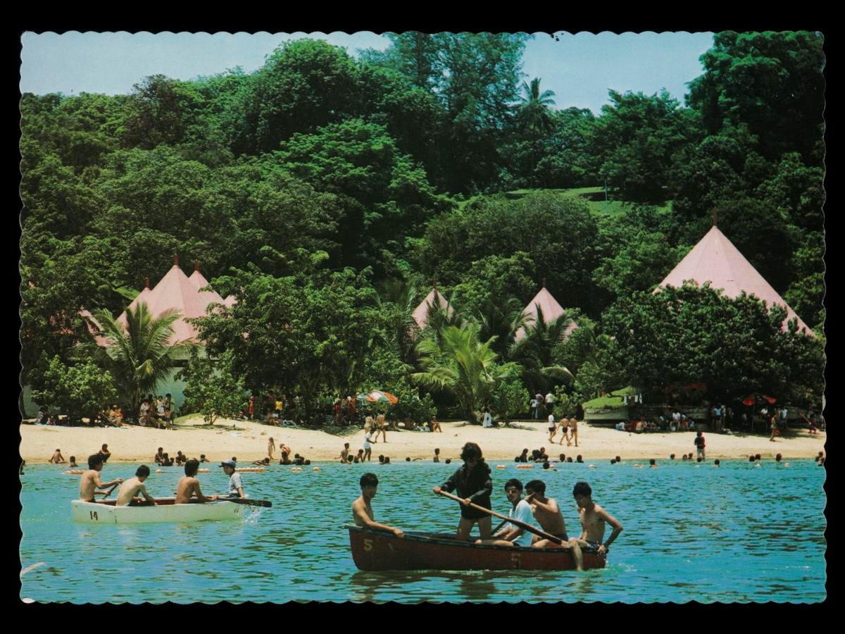 Boats in swimming lagoon at Sentosa