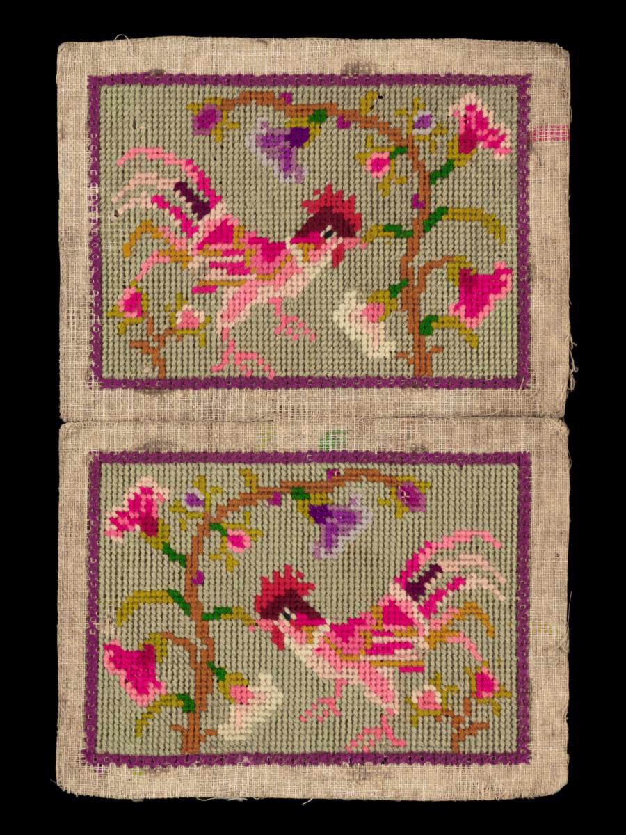 A pair of needlework samplers with motifs of roosters and plants