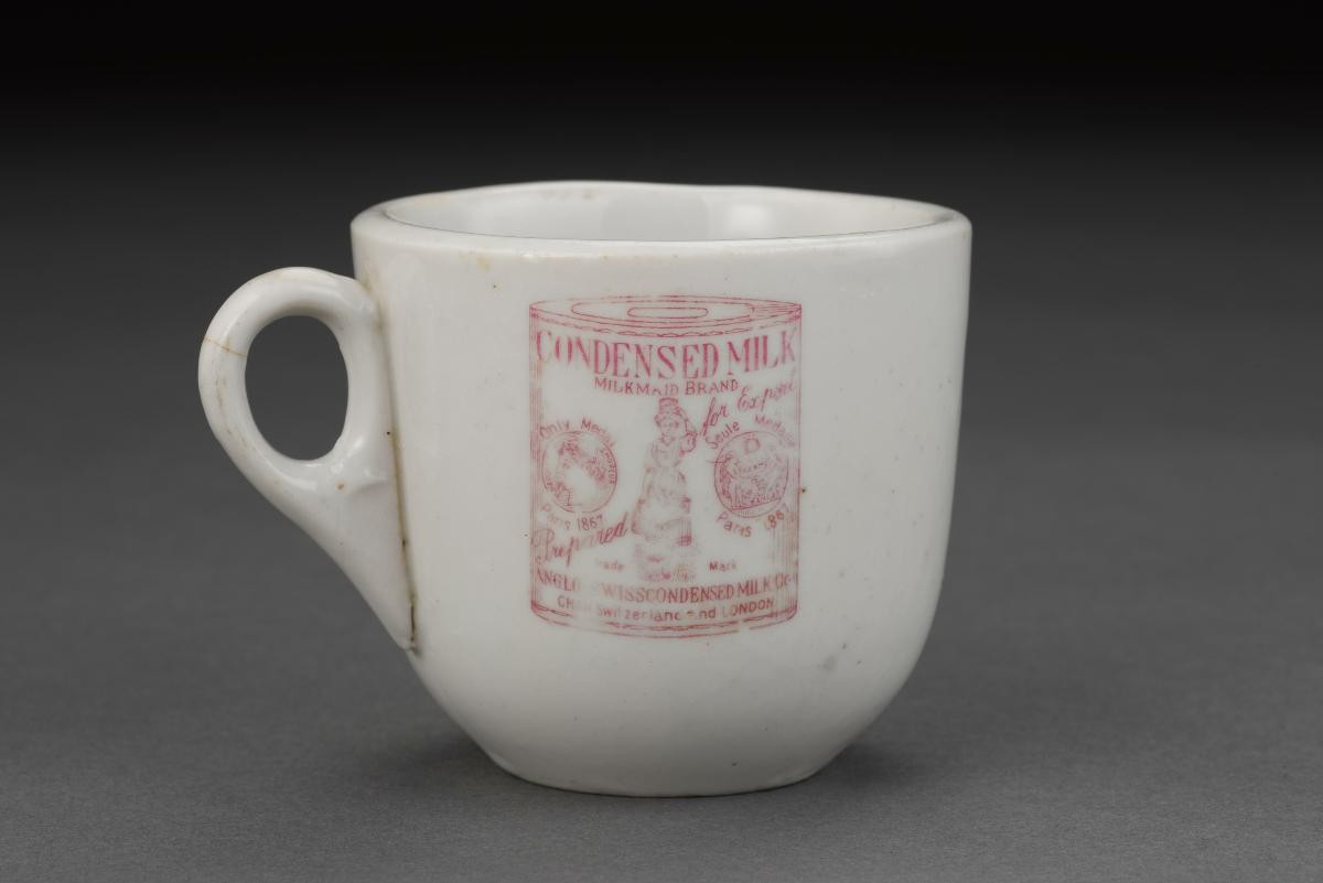 Porcelain cup with ‘Milkmaid Brand Condensed Milk’ logo