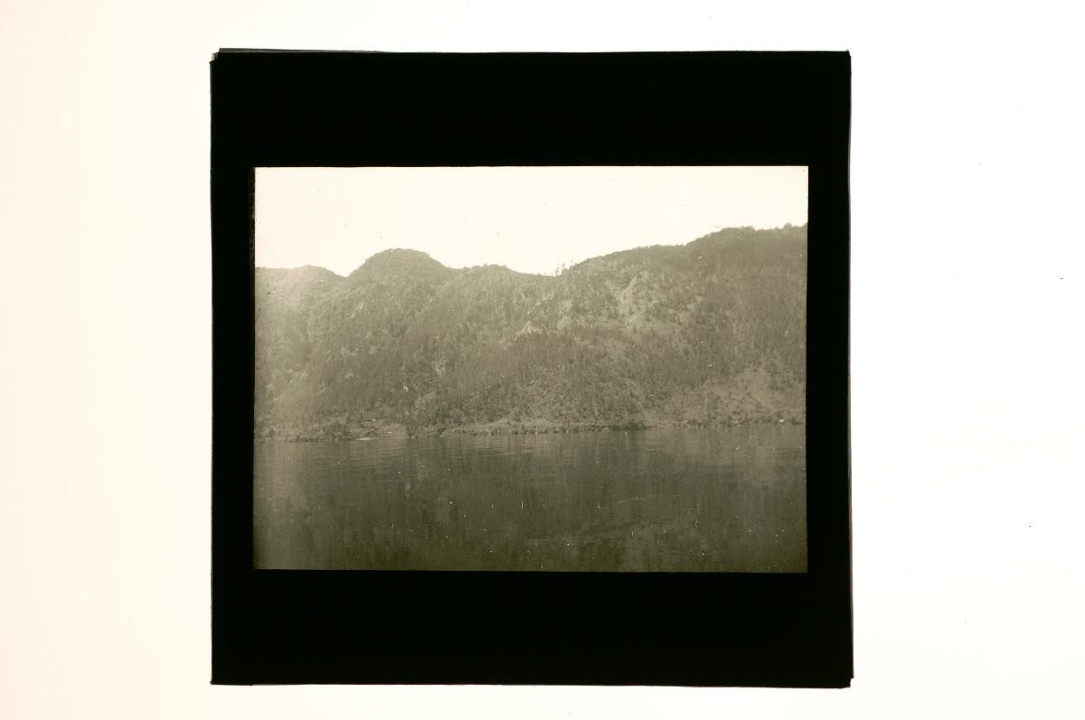 A glass lantern slide depicting a river scene