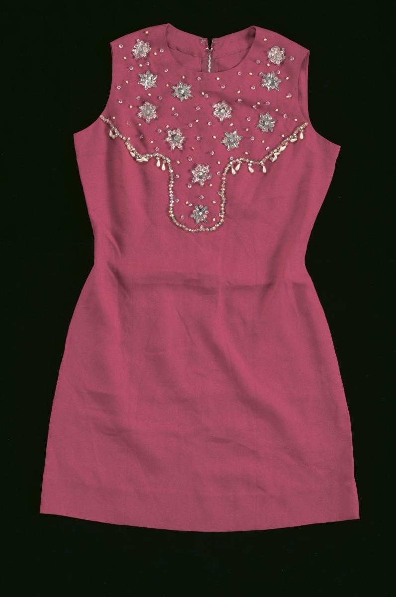 A red sleeveless mini dress with sequins and beads