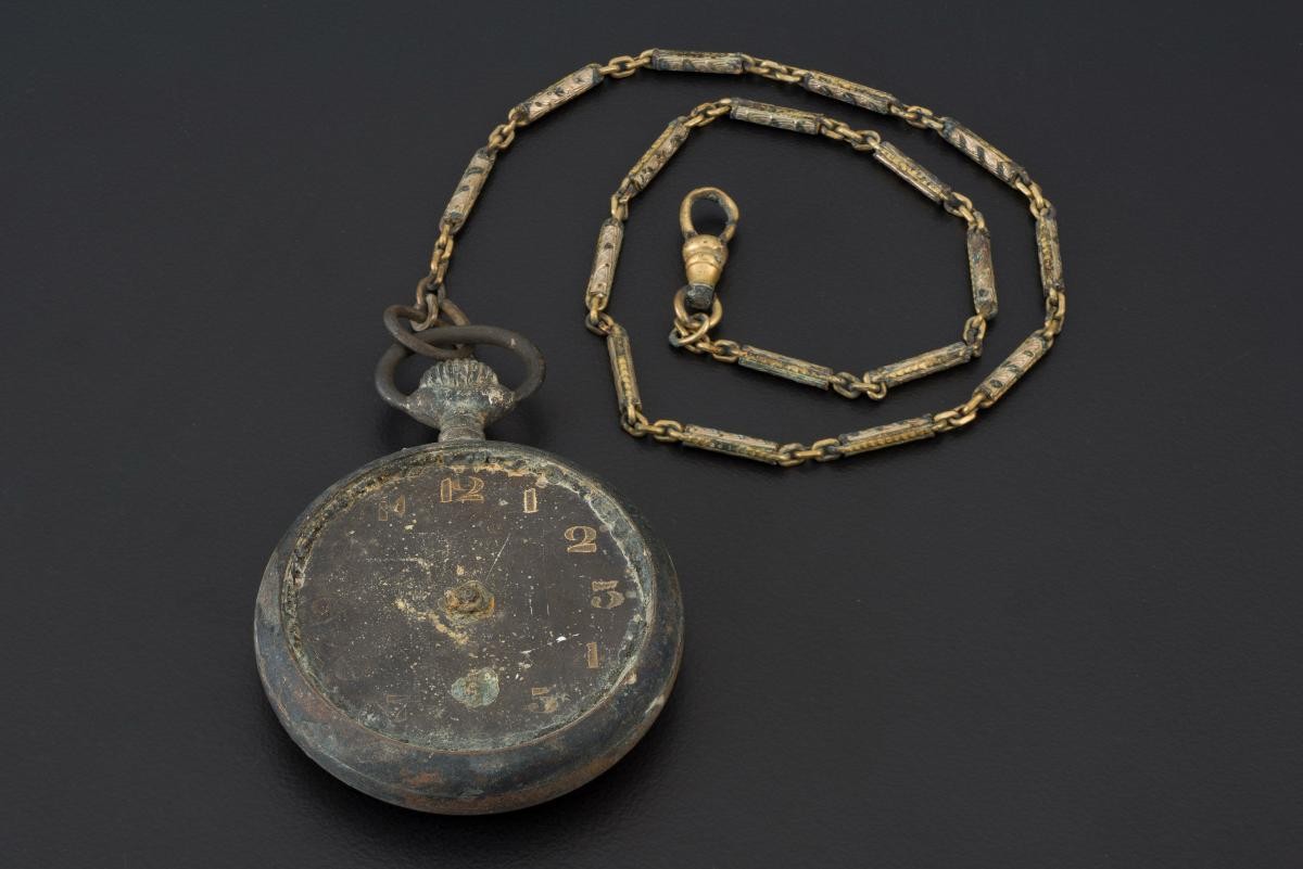 Pocket watch with a chain that belonged to a civilian victim of the Japanese Occupation