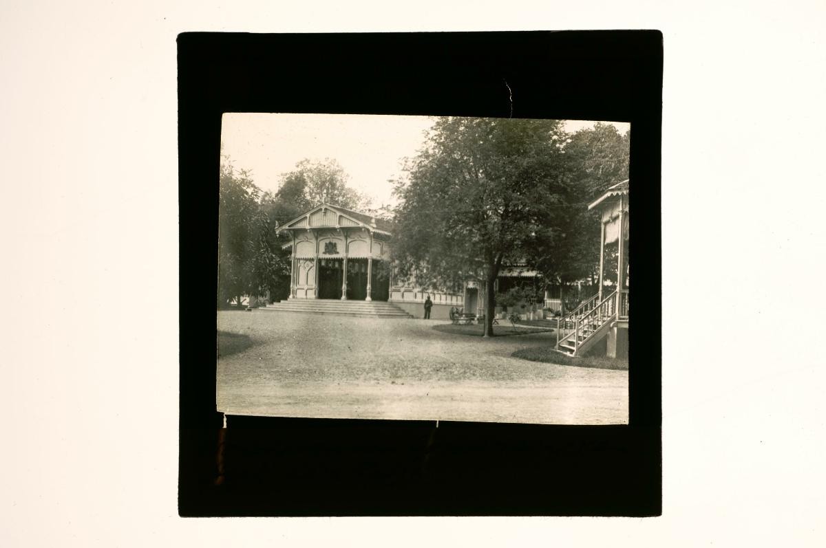 A glass lantern slide depicting a colonial building