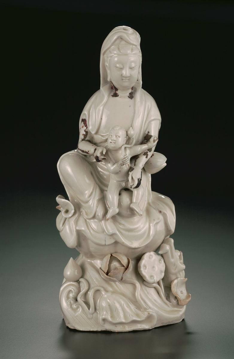 Guanyin holding a baby on her lap