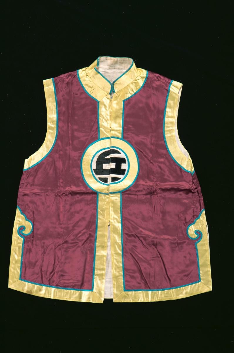 A sleeveless brown and yellow vest worn by a soldier in a Chinese opera