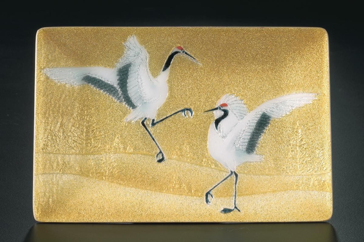 Golden yellow cloisonne enamel plate with storks