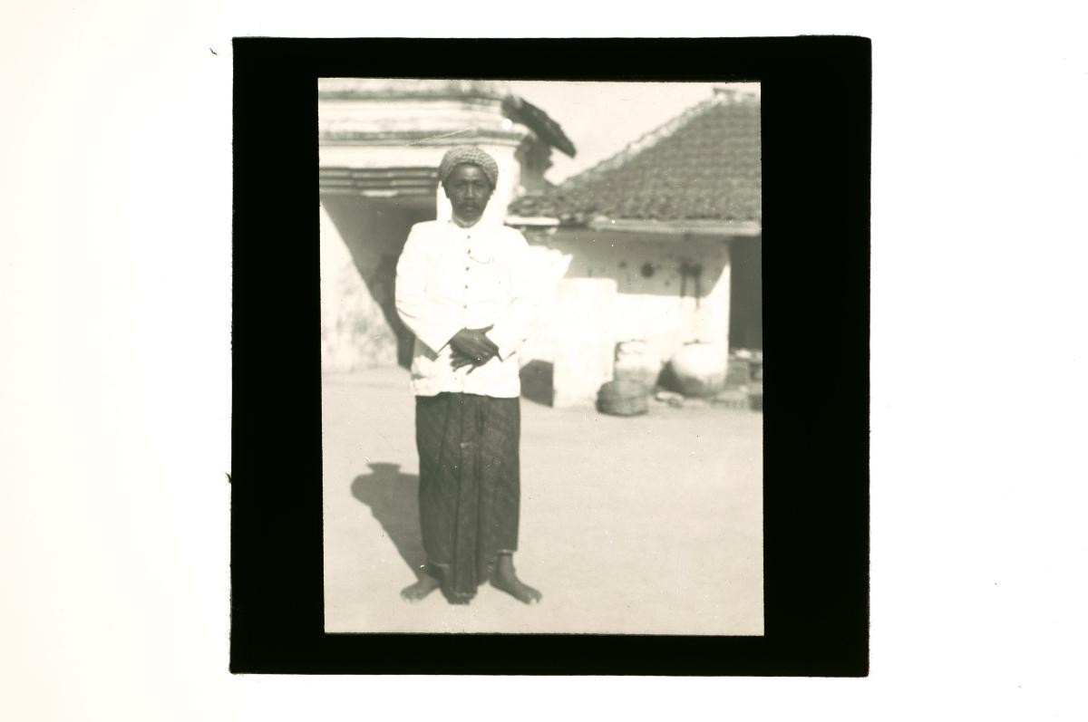A glass lantern slide depicting an Indonesian man