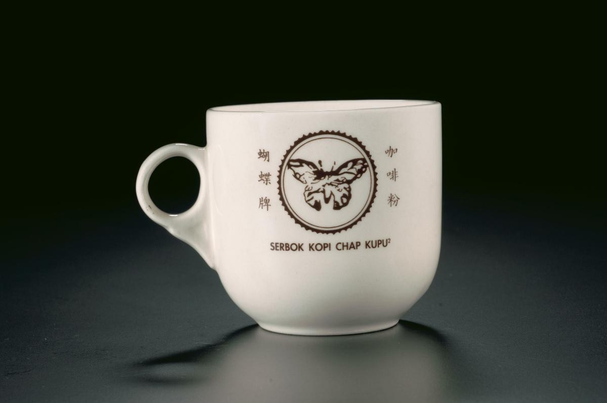 Porcelain cup with ‘Serbok Kopi Chap Kupu’ logo