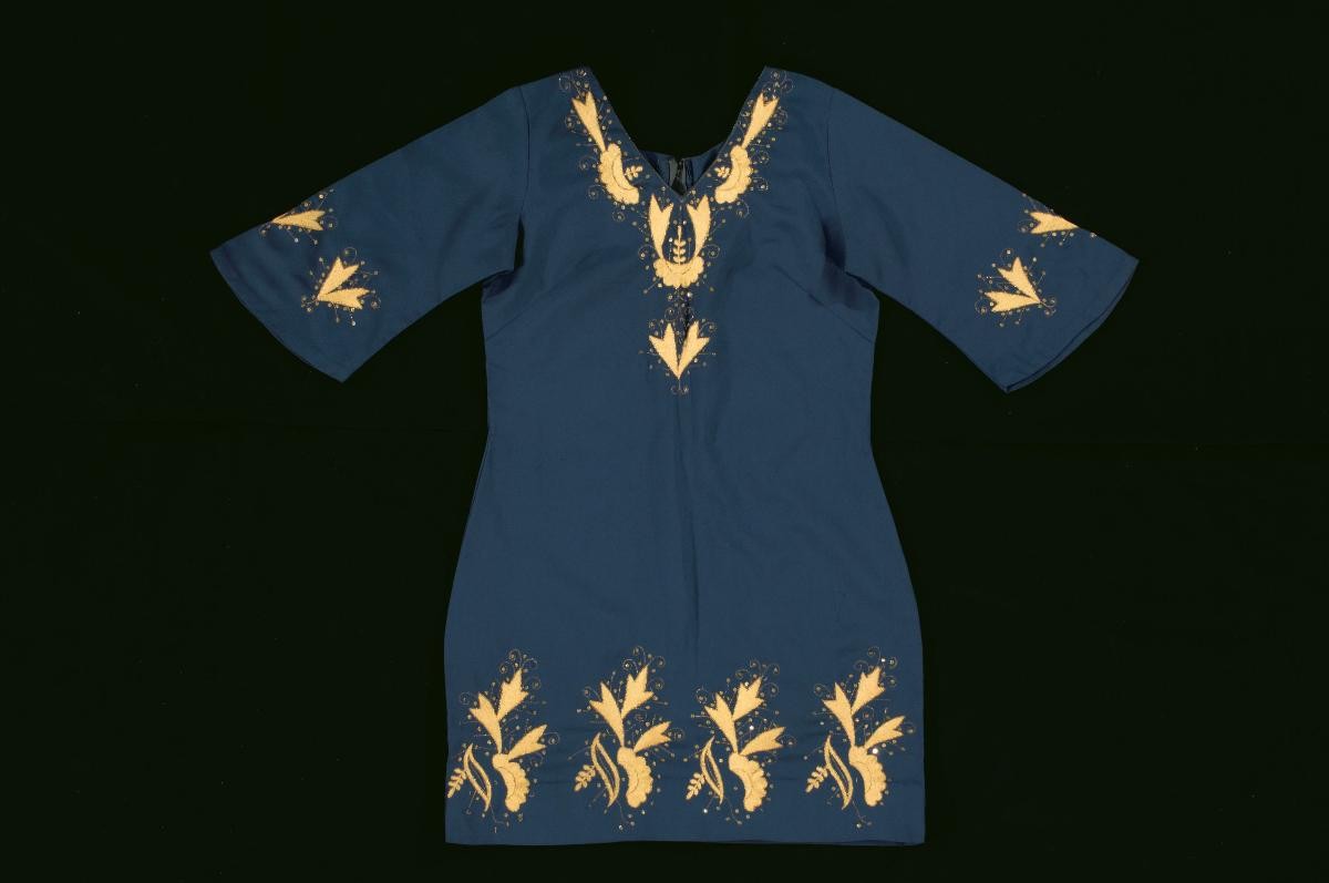 A blue kurta with embroidered gold floral motifs