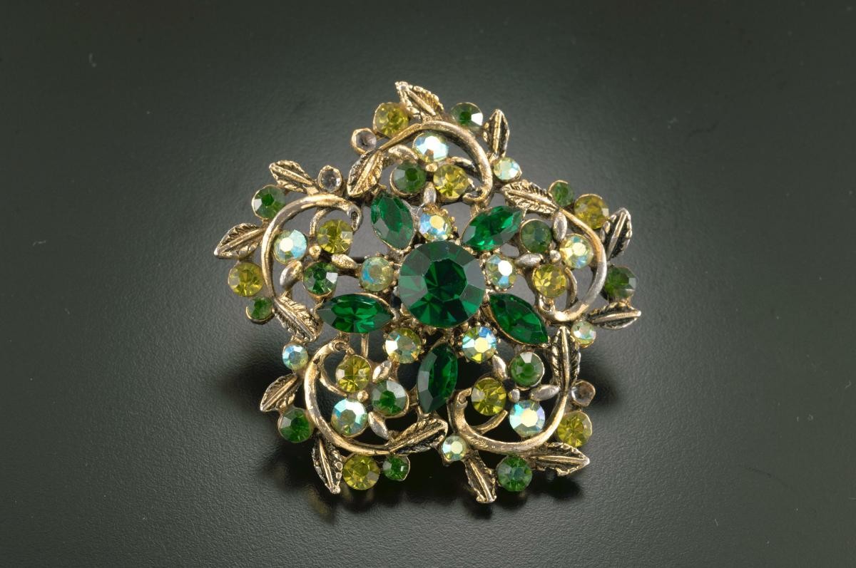 Green diamanté brooch that belonged to a notable women's rights activist