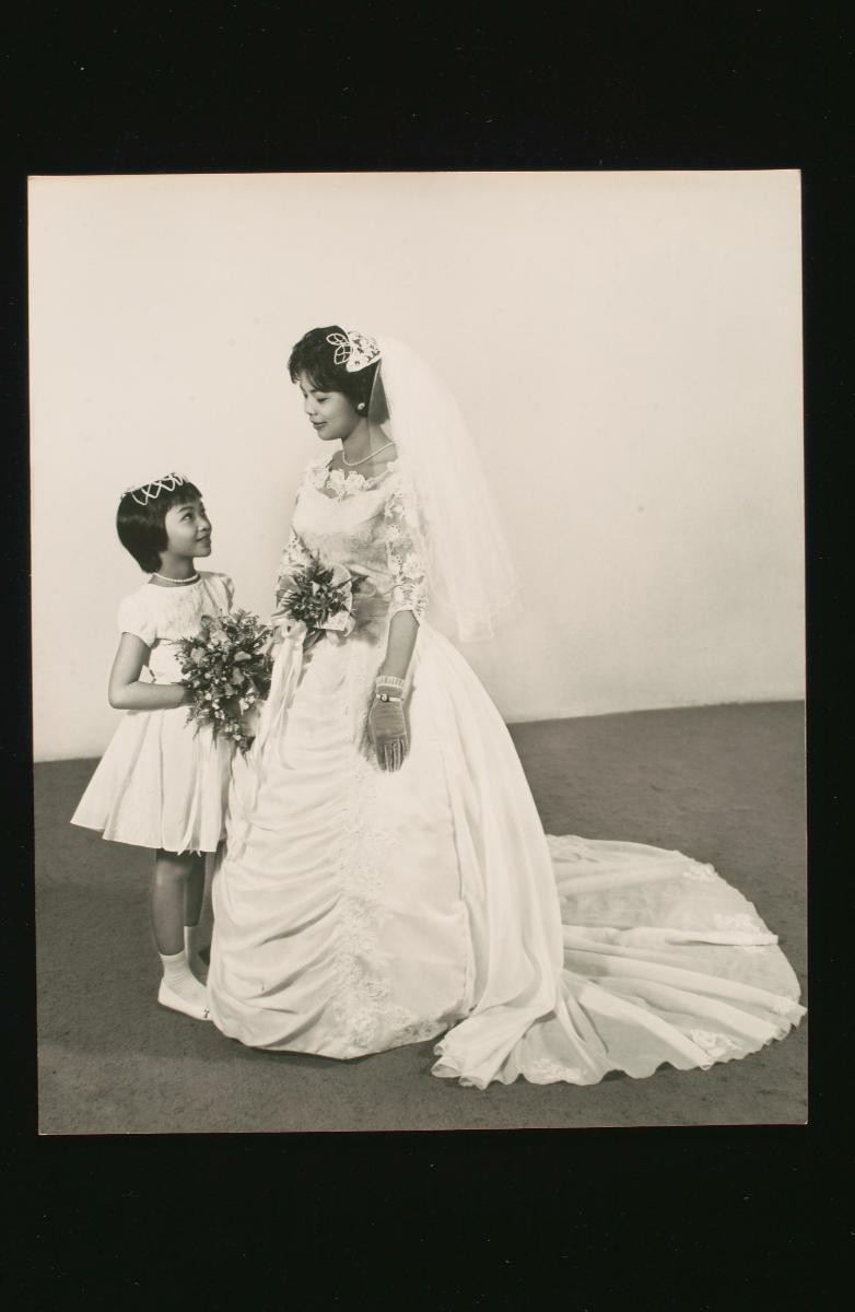 Portrait of a Chinese bride and a flower girl