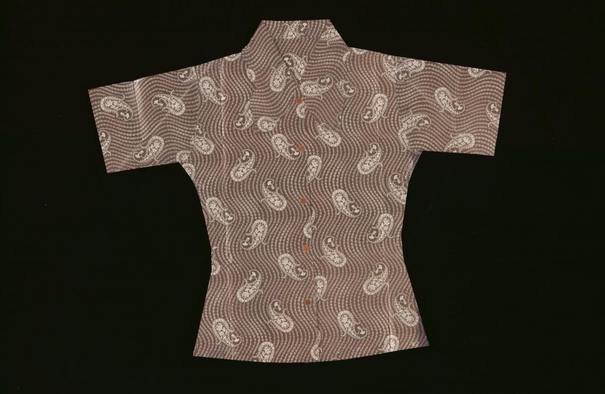 A brown paper blouse with floral motifs