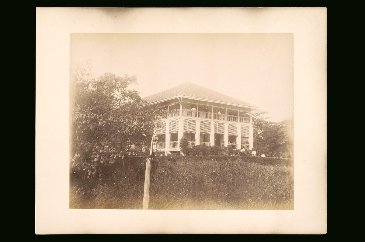View of a large house and people