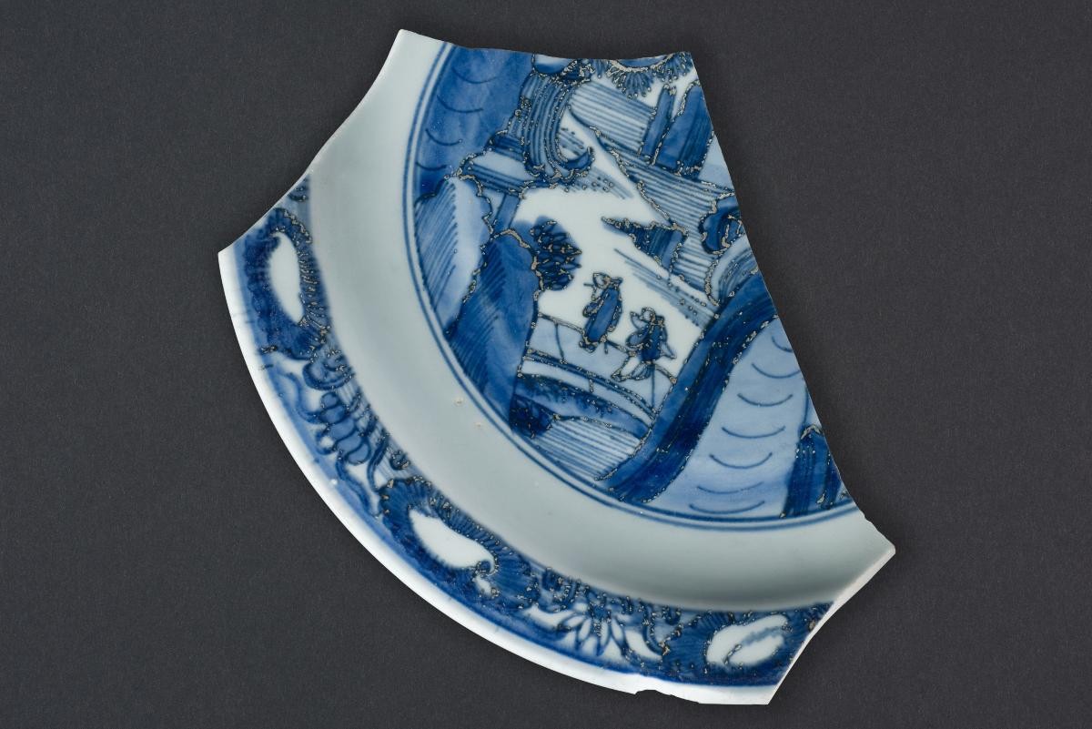 Fragment of a dish with a water-lily border