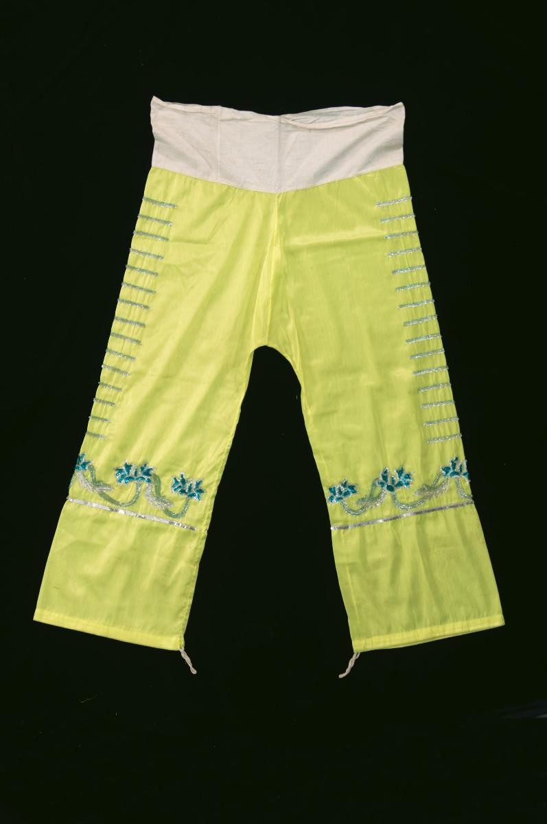 A pair of yellow trousers with green floral sequins worn by a ‘wu dan’ in a Chinese opera