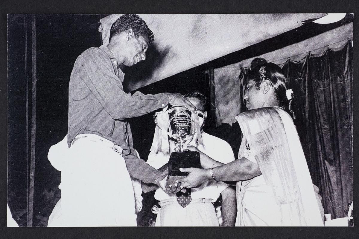 Trophy being presented to Jayaram s/o Rengasamy, Individual Champion for the years 1955, 56 and 57 at the Tamil’s Festival conducted by the Tamils Reform Association at Happy World Stadium