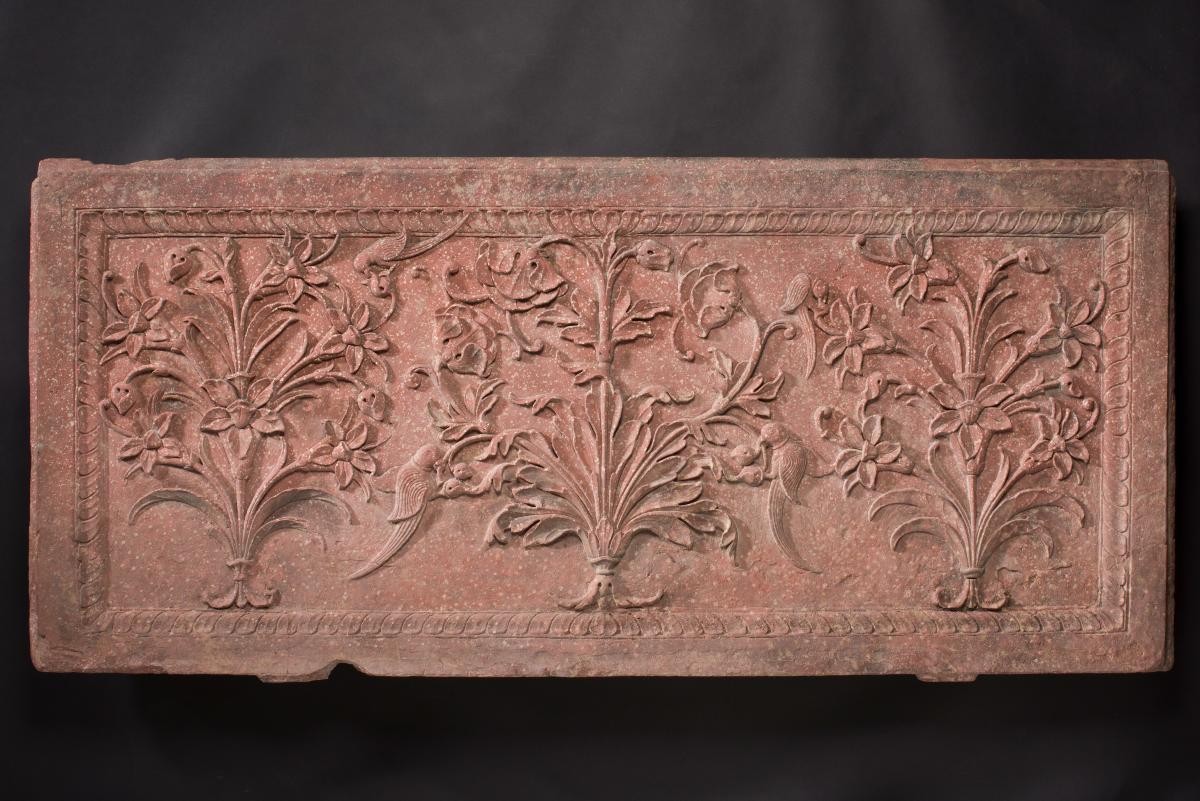 Relief panel with three flowering plants