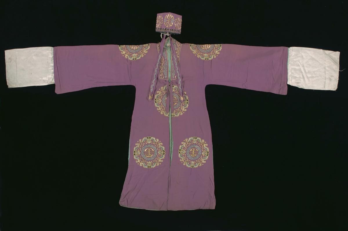 A set of purple costume with gold and blue motifs worn by a ‘wen xiao sheng’ in a Chinese opera