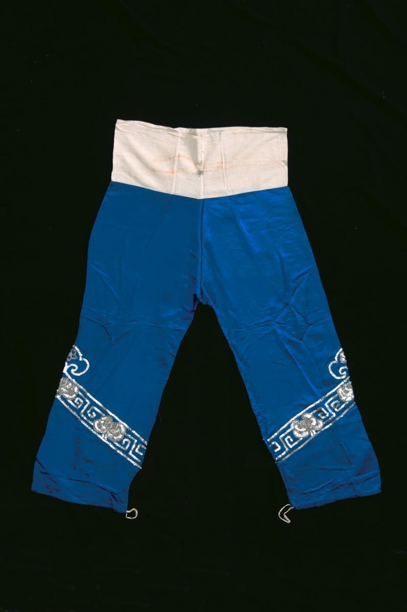A pair of blue trousers with silver floral sequins worn by a ‘wu dan’ in a Chinese opera