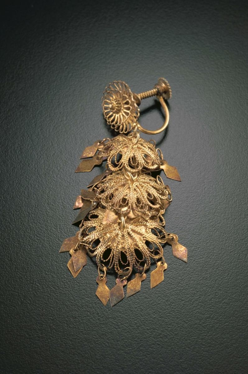 A pair of "golden leaf" ear rings that belonged to a notable women's rights activist