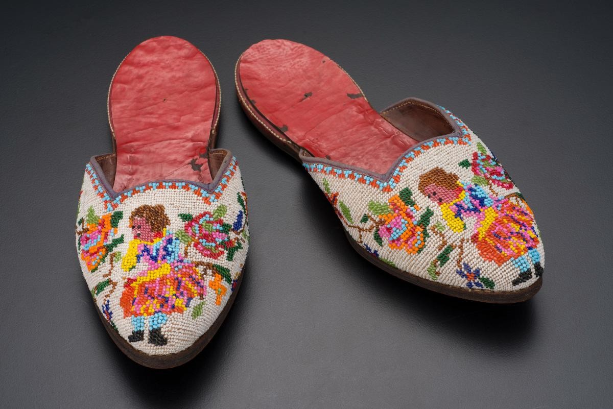 A pair of beaded slippers