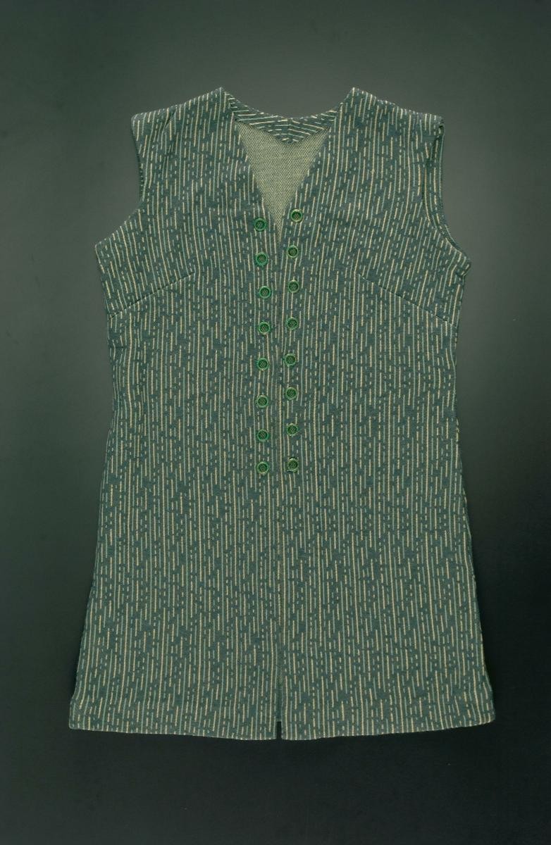 A green sleeveless v-neck top