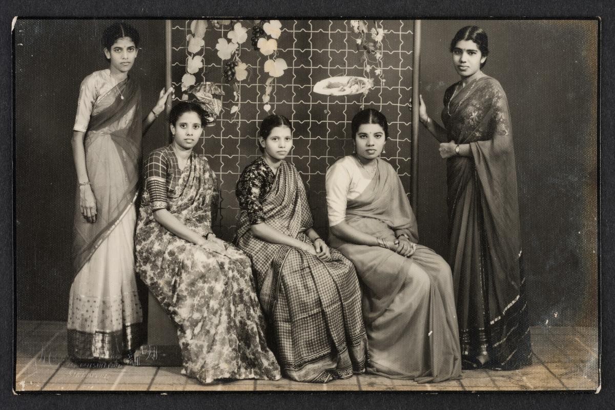 Marimuthu (standing, far most left), Vasantha (seated, far most left) with two friends and Shanmuga Vadivu (standing, far most right)
