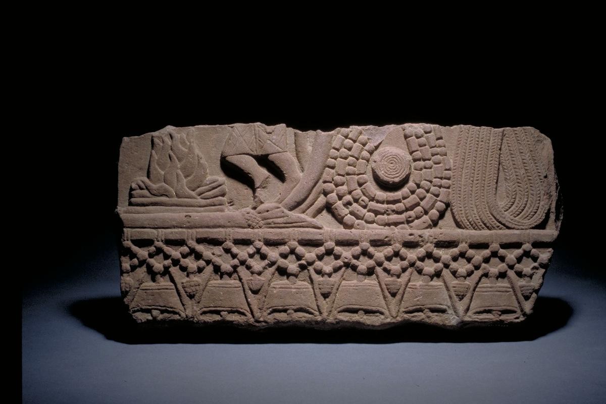 Relief fragment showing fire and human figure