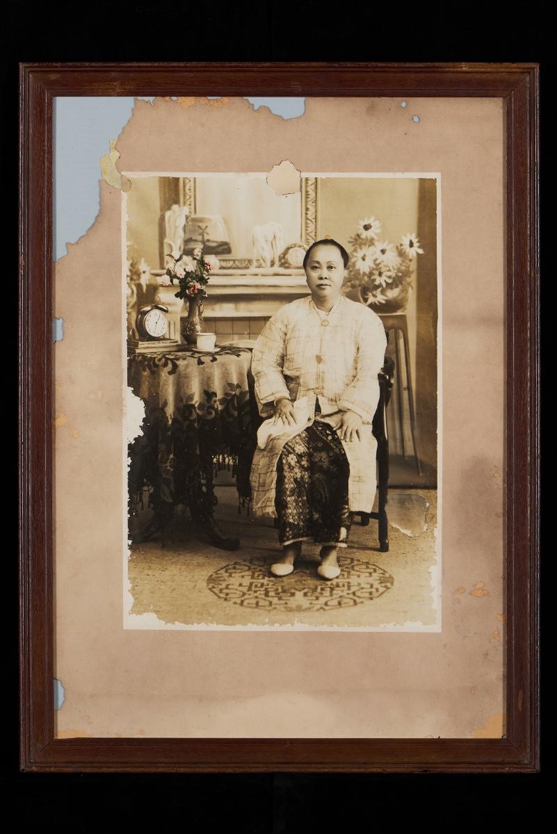 Large photograph of a nyonya, with hand-tinted flowers