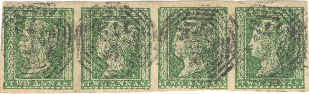 Horizontal strip of four Queen Victoria 2-anna green stamps issued in 1854.