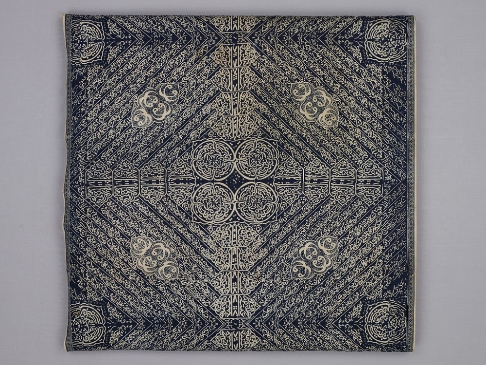<p style="text-align: center;"><a href="https://www.roots.gov.sg/Collection-Landing/listing/1225119"><strong>Calligraphic batik</strong></a><br> 2009-02990<br> Early to mid-20<sup>th</sup> century<br> Jambi, Indonesia<br> Collection of Asian Civilisations Museum