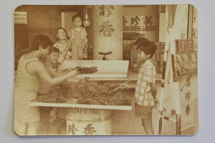 <span>This photograph, taken in the 1970s, shows employees barbecuing bak kwa at the New Bridge Road outlet, with the current third-generation owner and his mother in the middle. </span>