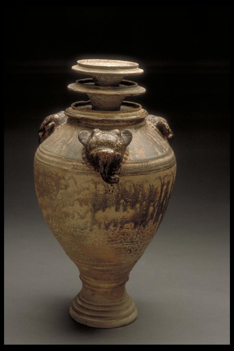 Large urn with decorative elephant heads
