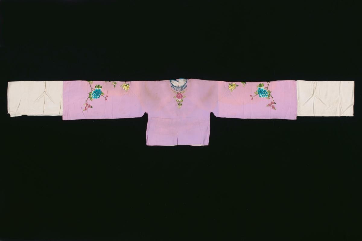 A pink top with floral embroidery worn by a ‘hua dan’ in a Chinese opera