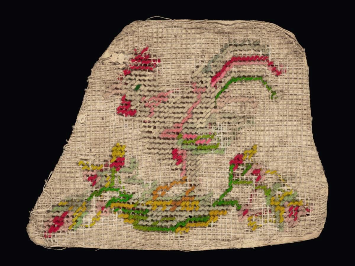 Needlework sampler with motif of a rooster