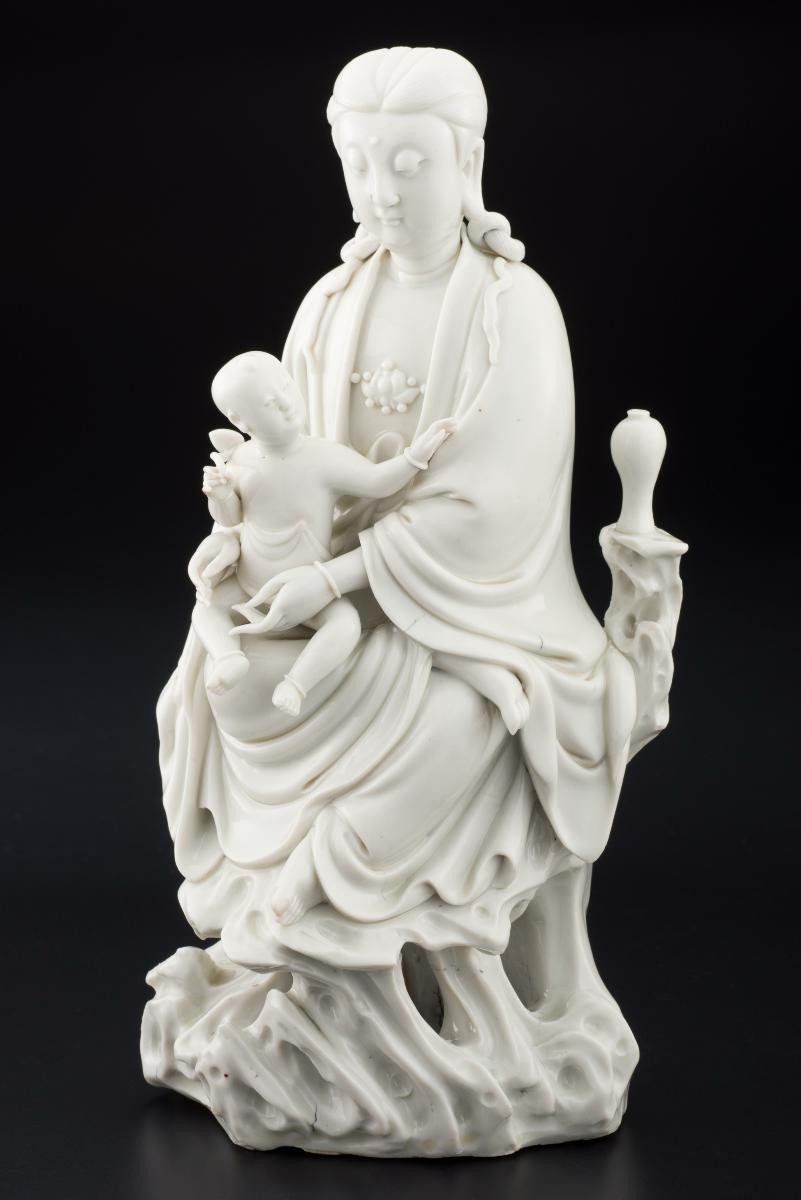 Seated Guanyin with a baby and meiping