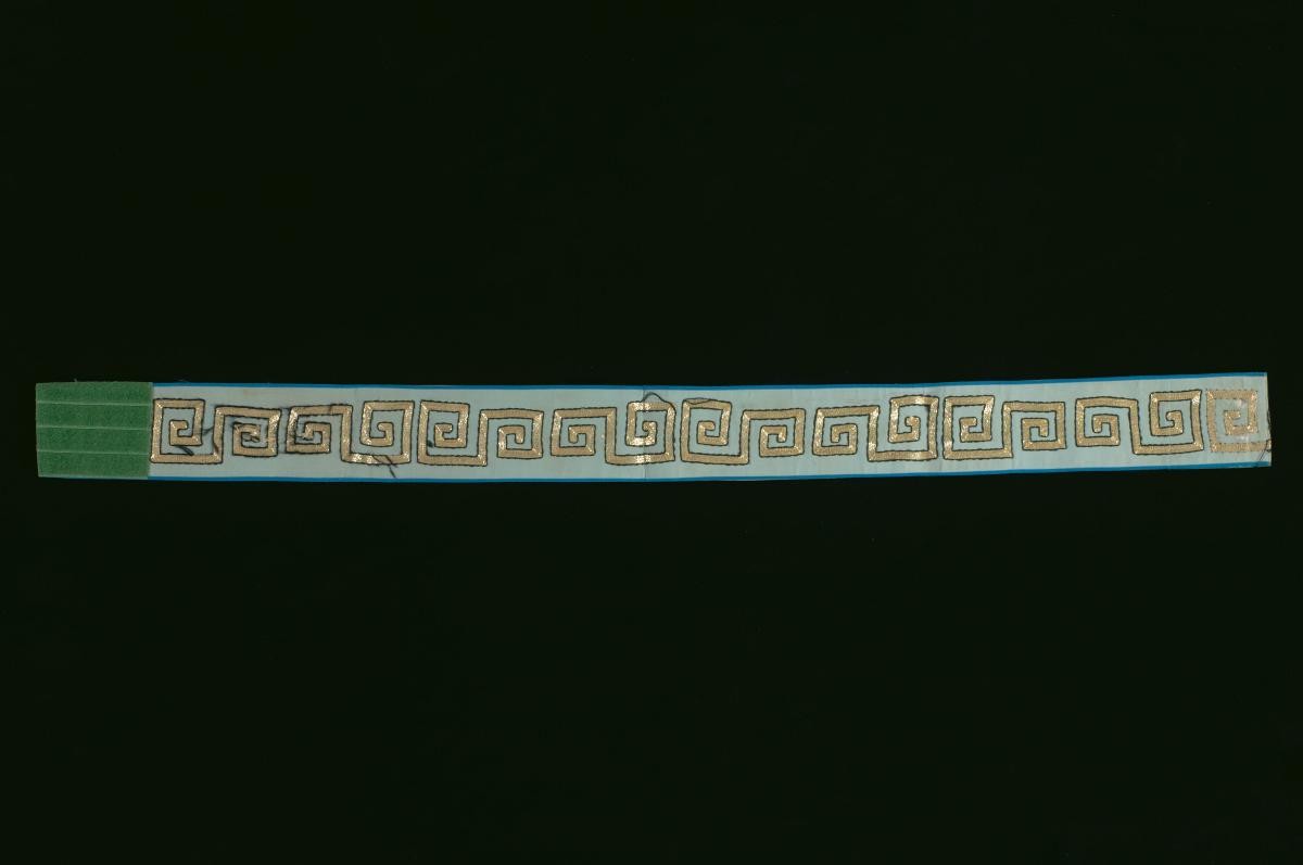 A blue belt with gold embroidery worn by an emperor in a Chinese opera