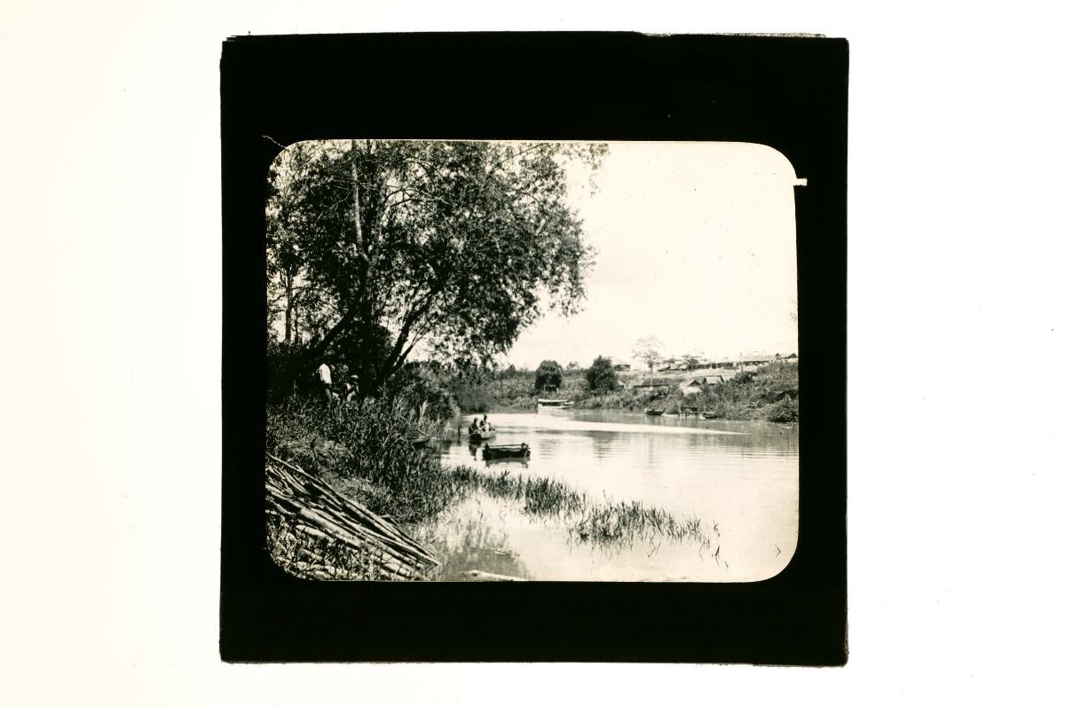 A glass lantern slide depicting a river scene