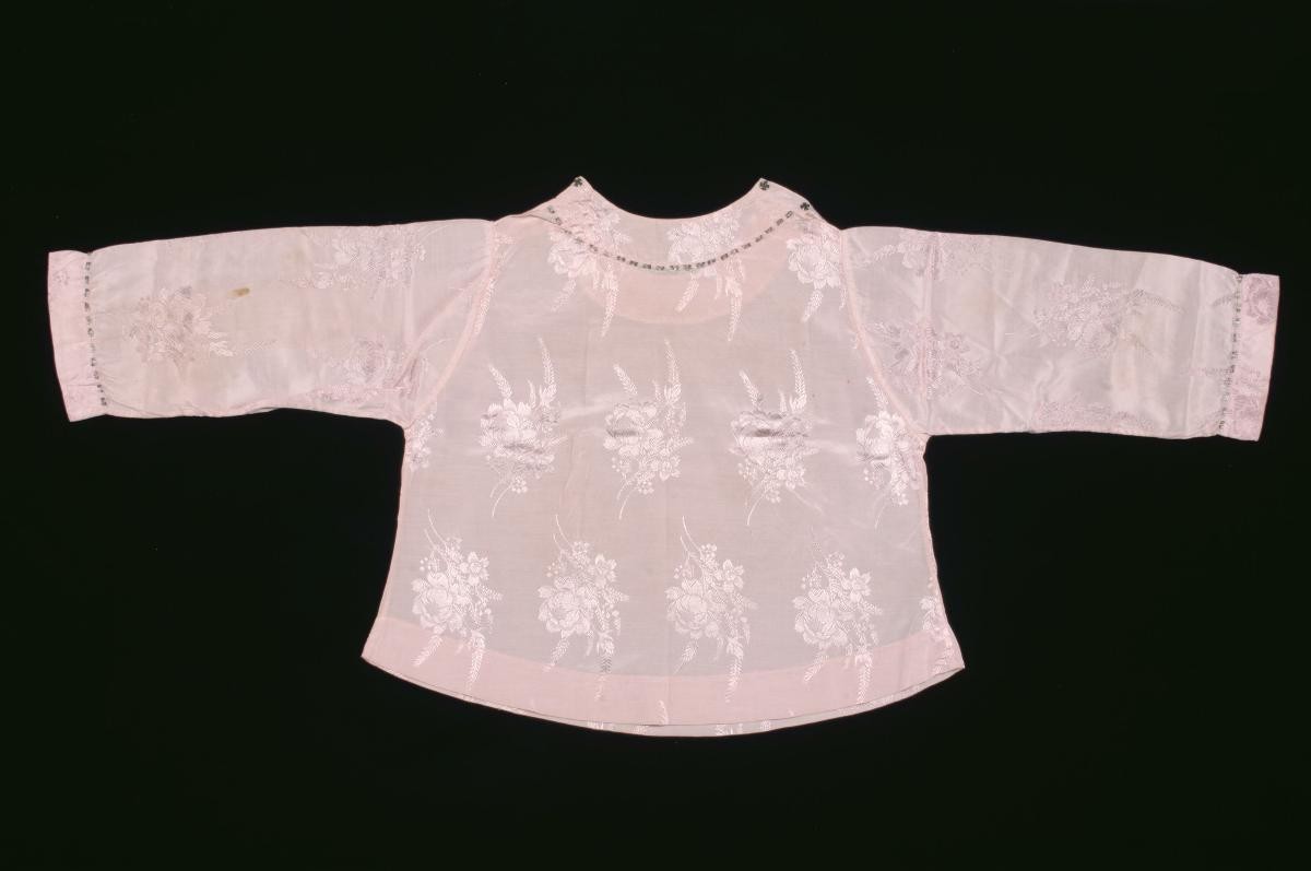 Pink long-sleeved blouse with a floral pattern