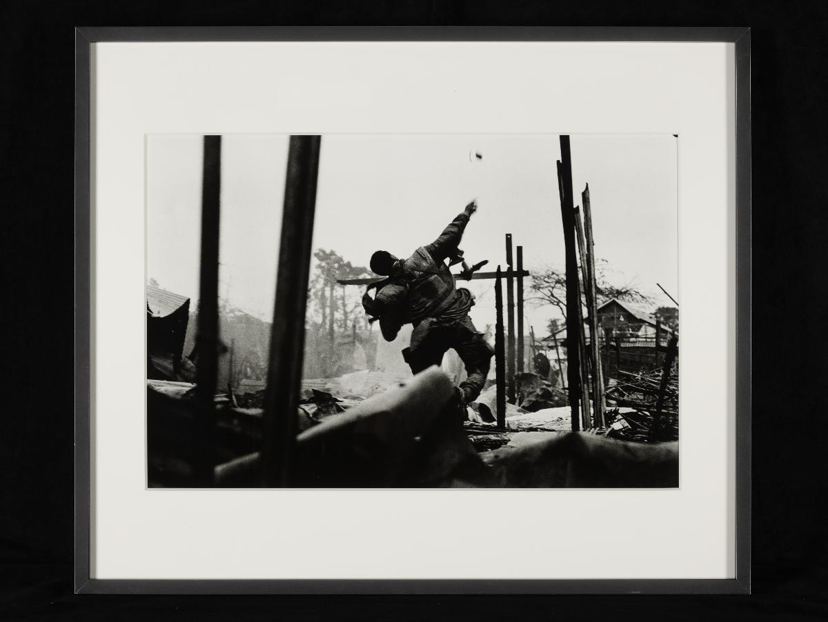 US Marine hurling a Grenade Seconds before being Shot through the Left Hand, Hue