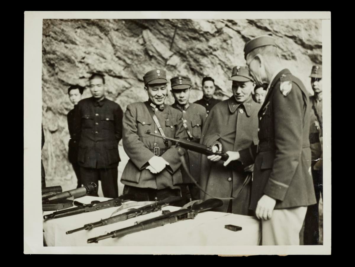 General Thomas Arms Shows an American Army Rifle to Chiang Kai-Shek
