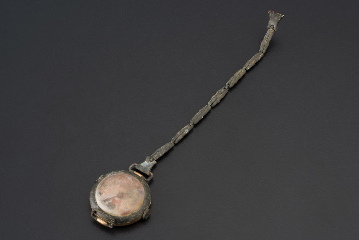 Pocket watch with a chain that belonged to a civilian victim of the Japanese Occupation