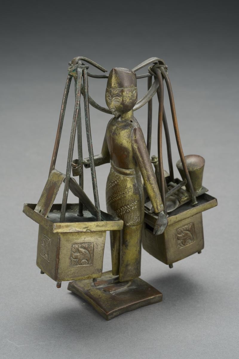 Metal statuette depicting a satay hawker