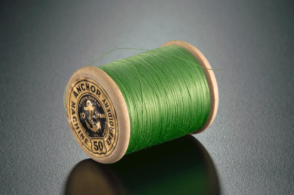 A spool of machine embroidery thread from Clark & Co’s Anchor Mills in Paisley