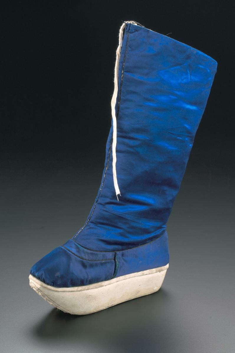 A dark blue platform boot worn in a Chinese opera performance