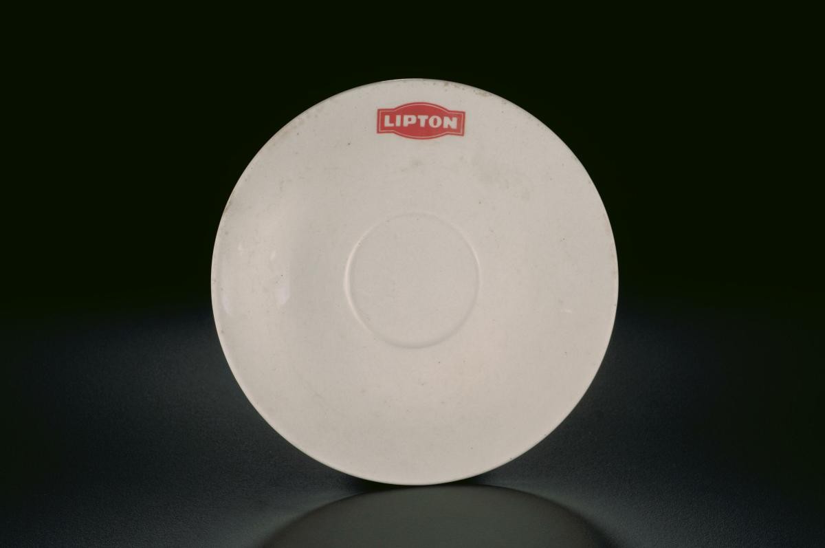 White porcelain saucer with Lipton logo