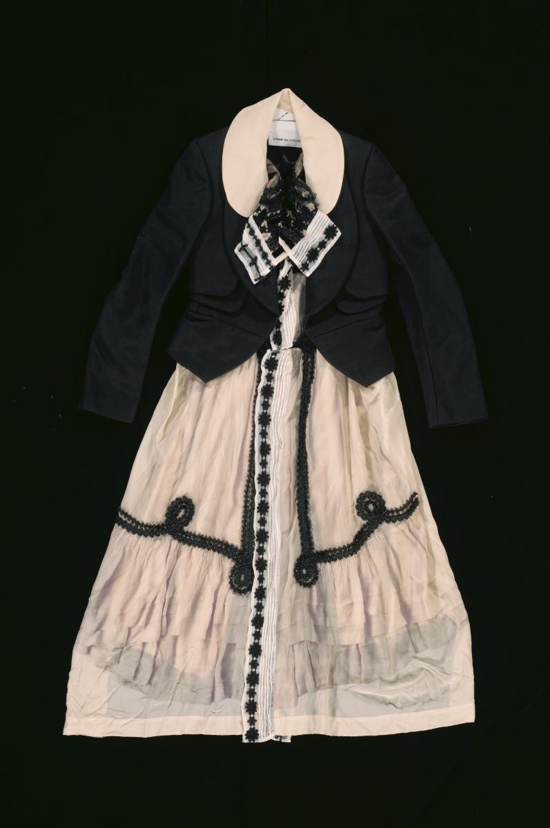 A Comme des Garcons black jacket with lace and ruffles