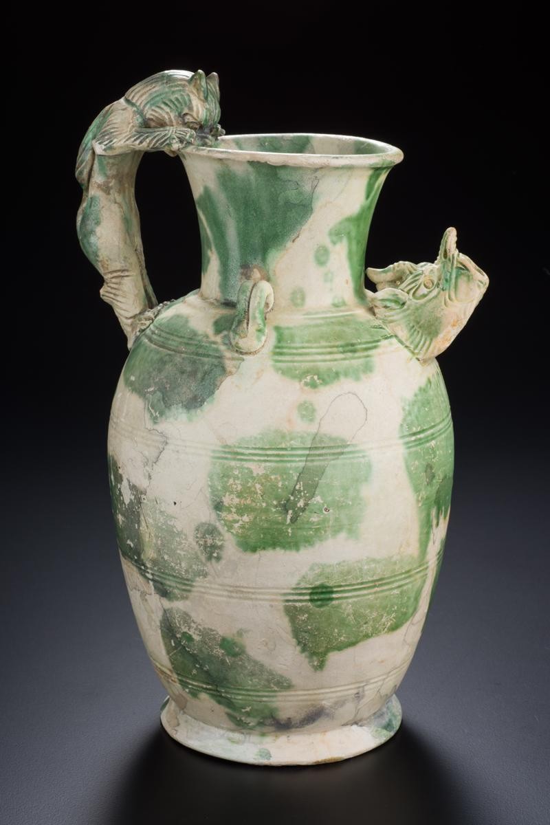 Ewer with feline-shaped handle